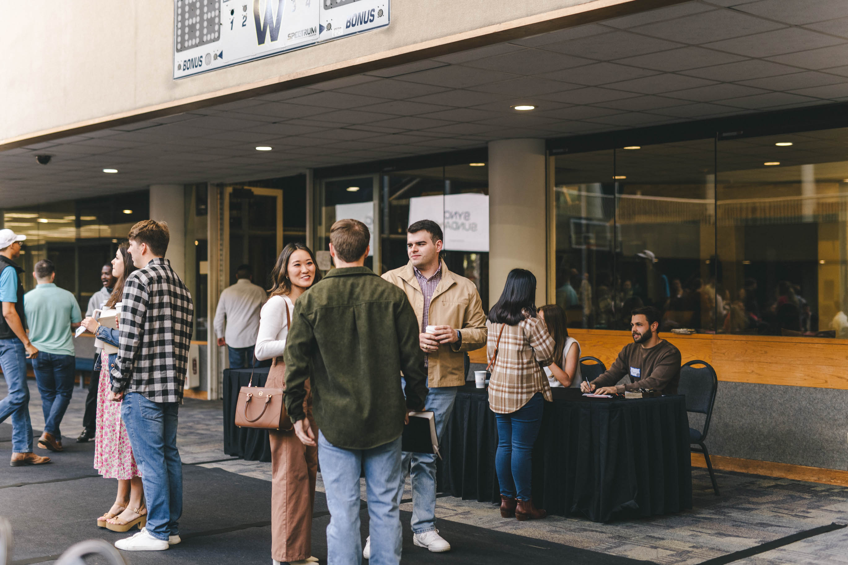 Young adults standing and talking